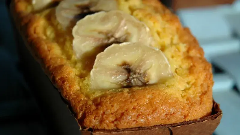 Banana bread loaf with banana slices on top