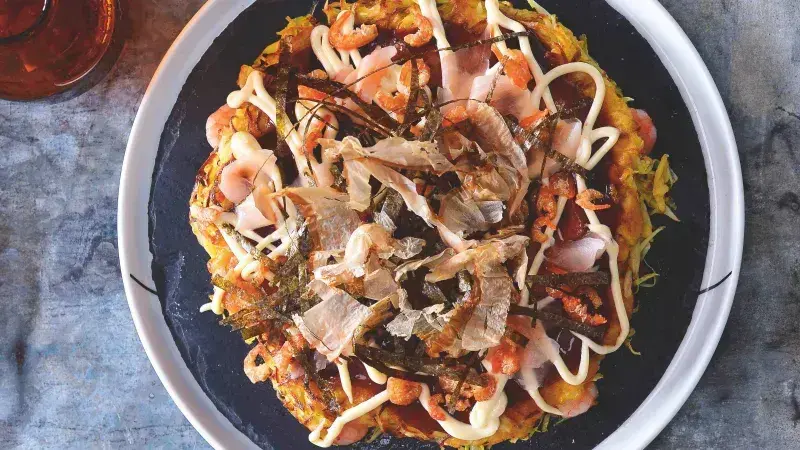 Okonomiyaki dish with toppings