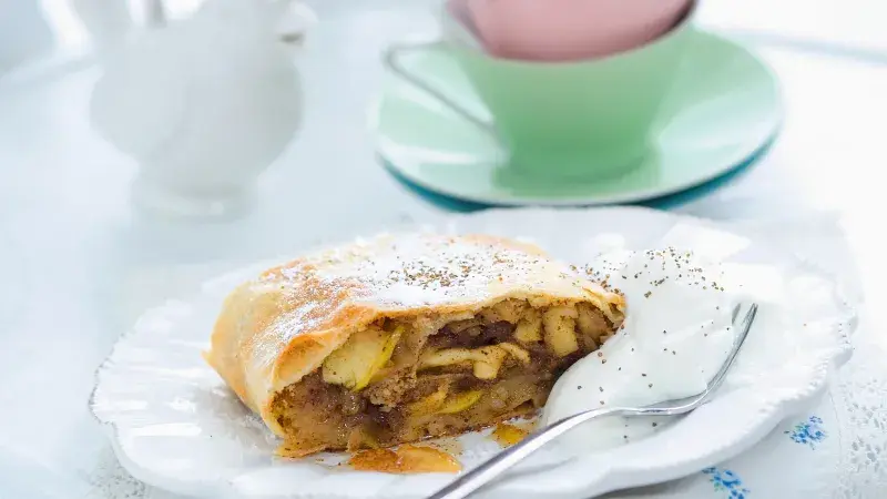 Apple strudel slice with cream