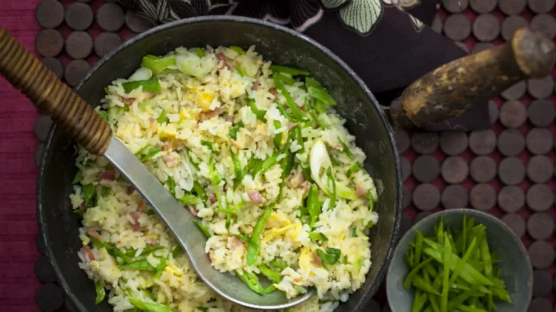 Fried rice with vegetables in pan
