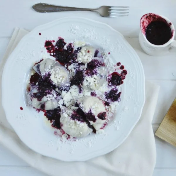 Dumplings with berry sauce