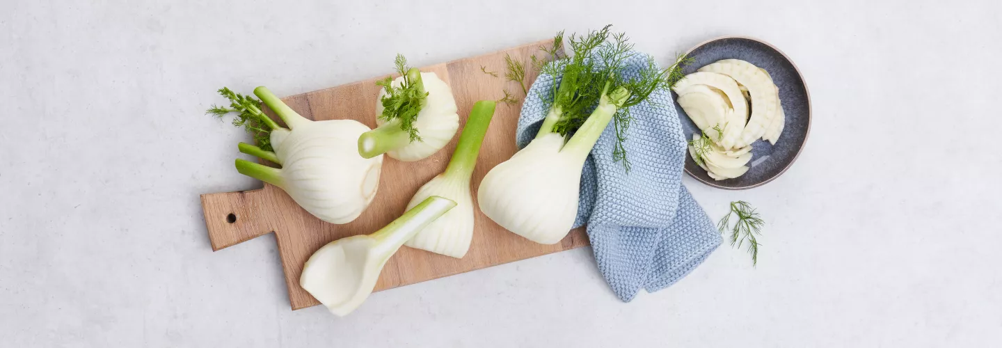 Whole and sliced fennel bulbs