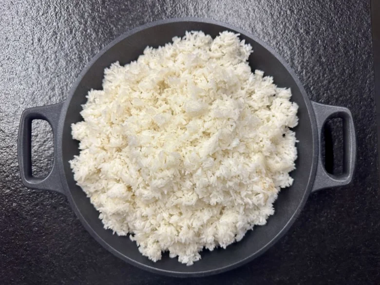 Cooked white rice in pan