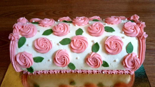 Decorated rolled cake with roses