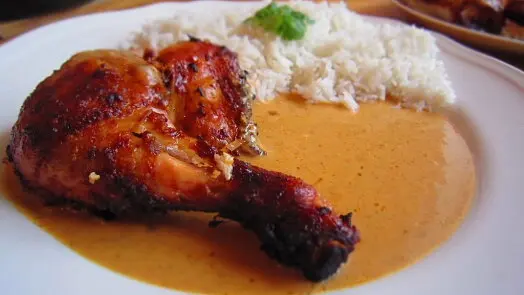 Chicken leg with rice and sauce
