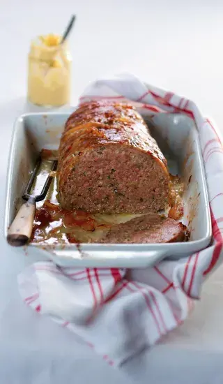 Cooked meatloaf with slice removed