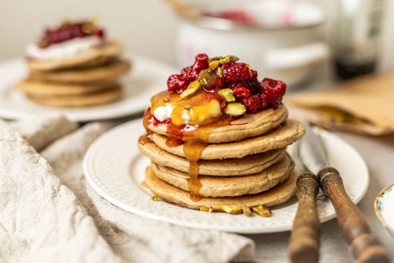 Stack of pancakes with toppings